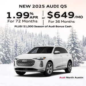 Side view of an Audi Q5 driving.